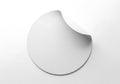 Blank circular sticker with a peeling corner isolated on a white background Royalty Free Stock Photo
