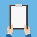 Blank clipboard in hands businessman. Empty space for text. Blank sheet white paper