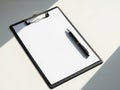 Blank clipboard with pen ready for note-taking Royalty Free Stock Photo