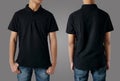 Blank collared shirt mock up template, front and back view, Asian teenage male model wearing plain black t-shirt on gray Royalty Free Stock Photo