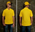 Blank collared shirt mock up template, front and back view, Asian teenage male model wearing plain yellow t-shirt. Polo tee design Royalty Free Stock Photo