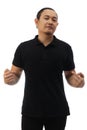 Blank collared shirt mock up template, front view, Asian male model wearing plain black t-shirt isolated on white. Polo tee design Royalty Free Stock Photo