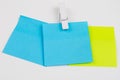 Blank colored sticky notes with clips. Office accessories for listing and memorizing on the table.