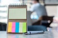 Blank colorful note paper or empty reminder template with pen on wooden table. Copy space for your text