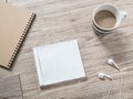 Blank compact disc , arphones,notebook and coffee on wooden background Royalty Free Stock Photo