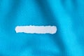 Blank copy space scrap of paper on blue background cloth of textile Royalty Free Stock Photo