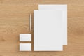 Blank corporate stationery set mockup with sheets of office paper, business cards and pen on wooden background. Branding mock up. Royalty Free Stock Photo