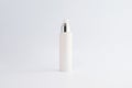 Blank cosmetic pump top silver bottle mock up on background with copy space