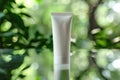 Blank Cosmetic Tube on Natural Green Bokeh Background Royalty Free Stock Photo