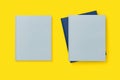 Blank cover blue books on yellow background, mockup Royalty Free Stock Photo