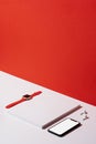 Blank cover magazine and smartphone mockup organised neatly on red and white background Royalty Free Stock Photo