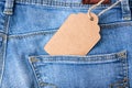 Blank craft cardboard label tag in a jeans denim pocket for sale and discount design