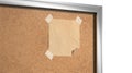 Blank craft paper note taped cork-board mockup, depth of field Royalty Free Stock Photo