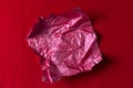 Crumpled red candy wrapper