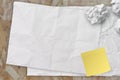 Blank crumpled sticky note paper on texture paper Royalty Free Stock Photo