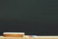 Blank Dark blackboard with color Chalk and eraser Royalty Free Stock Photo