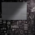 Blank dark sheet paperon hand drawn business strategy background Royalty Free Stock Photo