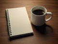 A blank diary note book and a cup of hot coffee on table