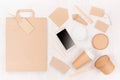 Blank different cardboard packaging for fast food - bag, coffee cup, screen phone, cutlery, sugar, spice, container and box. Royalty Free Stock Photo