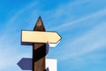 Blank directional road signs against blue sky. Empty arrow with Royalty Free Stock Photo