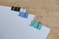 Blank document papers with colored paper clips pastel on wooden table. Document management concept Royalty Free Stock Photo
