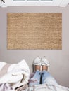 Blank doormat before the door in the hall. Mat on gray floor, girl in white shoes. Welcome home, product Mockup Royalty Free Stock Photo