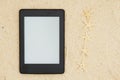 An e-reader on the beach for your summer reading with five starfish Royalty Free Stock Photo