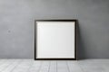 Blank empty picture frame mockup on gray cement wall. Royalty Free Stock Photo