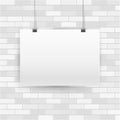 Blank empty A4 sized horizontal vector poster mockup, paper frame hanging on binder. White brick wall background Royalty Free Stock Photo