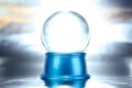 Blank empty snowglobe. Glass snow globe on blue base Royalty Free Stock Photo