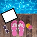 Blank empty tablet computer, summer accessories on beach. Royalty Free Stock Photo