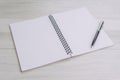 Blank empty white page note book opening with pen on gray wooden table using as journal thinking, writing and creativity Royalty Free Stock Photo