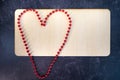 Blank empty wood sign no writing red beads in the shape of a hearts ready to add text Royalty Free Stock Photo