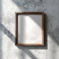 Blank Wooden Frame Mockup on Concrete Wall with Natural Light Royalty Free Stock Photo