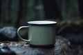 Blank enamel coffee cup mockup, camping mug in forest