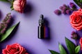 blank essence oil bottle with flowers, flatlay composition on purple background. natural cosmetics
