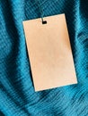 Blank fashion label tag, sale price card on luxury fabric background, shopping and retail