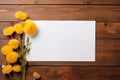 Blank floral mockup of white sheet of paper with dandelion flowers with copy space, top view.
