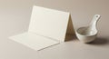 A blank, folded card and an envelope are placed side by side on a beige surface. Next to Royalty Free Stock Photo