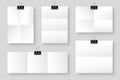 Blank folded paper sheets with binder clips. White notebook or book page and metal holder. Design template or mockup Royalty Free Stock Photo