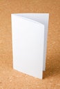 Blank folding one page booklet on corkboard background