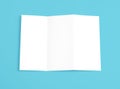 Blank folding page booklet on blue background.