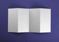 Blank folding page booklet on purple background.