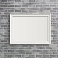 Blank frame on grey birck wall