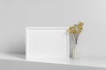 Blank frame mockup for artwork, photo or print presentation. White minimalistic interior with dry flowers Royalty Free Stock Photo