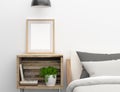 Blank frame mockup on bedroom side table Royalty Free Stock Photo