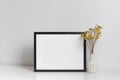 Blank frame mockup in white room with copy space for artwork, photo or print presentation Royalty Free Stock Photo