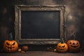 Blank frame for text with small pumpkins in front of black wall. Halloween holiday, autumn concept Royalty Free Stock Photo