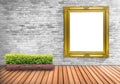 Blank frame vintage on a concrete wall with tree pot on wood flo Royalty Free Stock Photo