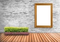 Blank frame vintage on a concrete wall with tree pot on wood flo Royalty Free Stock Photo